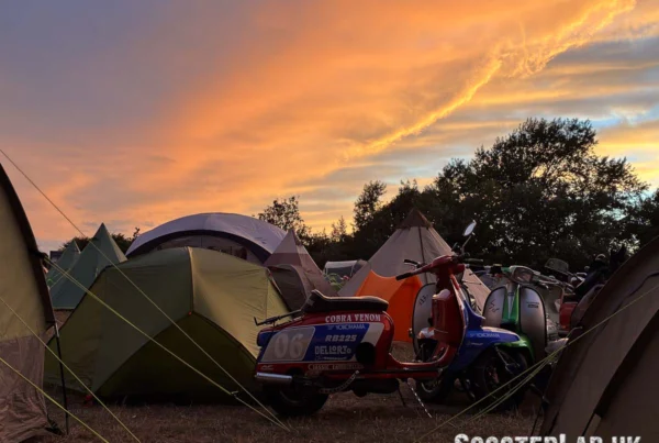 A sunset over a a scooter rally campsite.